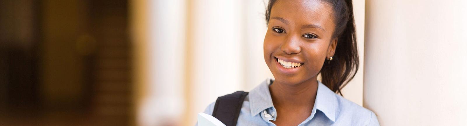 woman smiling in hallway